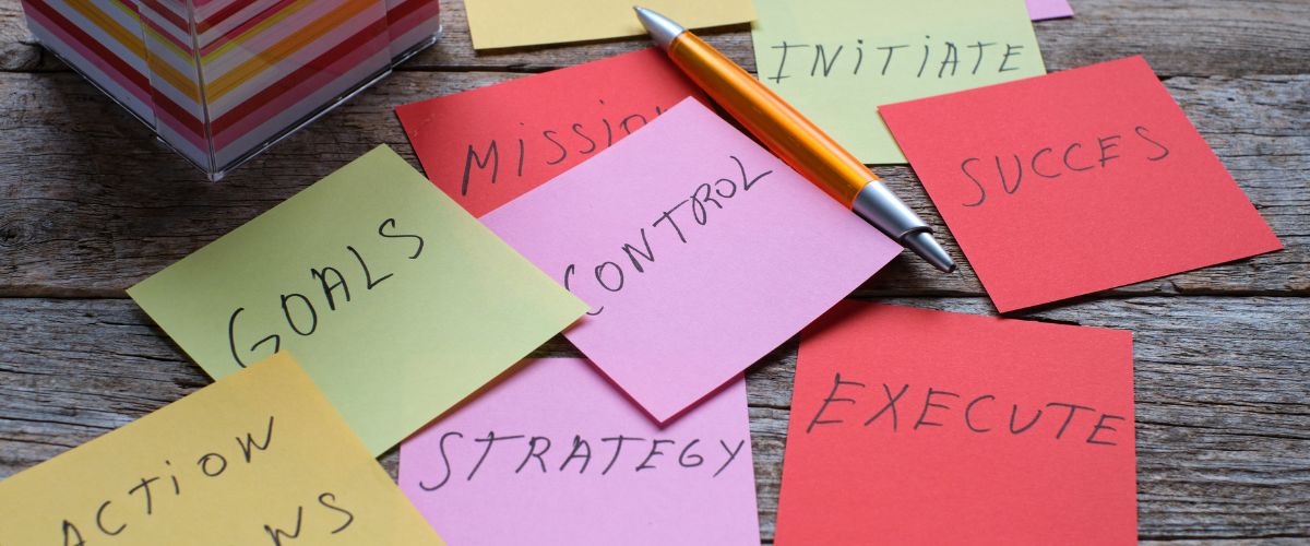 Bureaucracy pile of post it notes including strategy missing control all in different colours