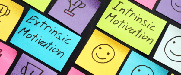 Motivation post it notes. Intrinsic or extrinsic.