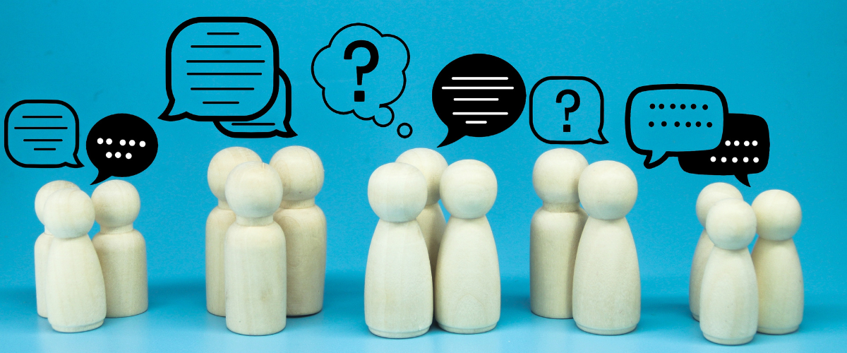 Lots of wooden people having conversations.